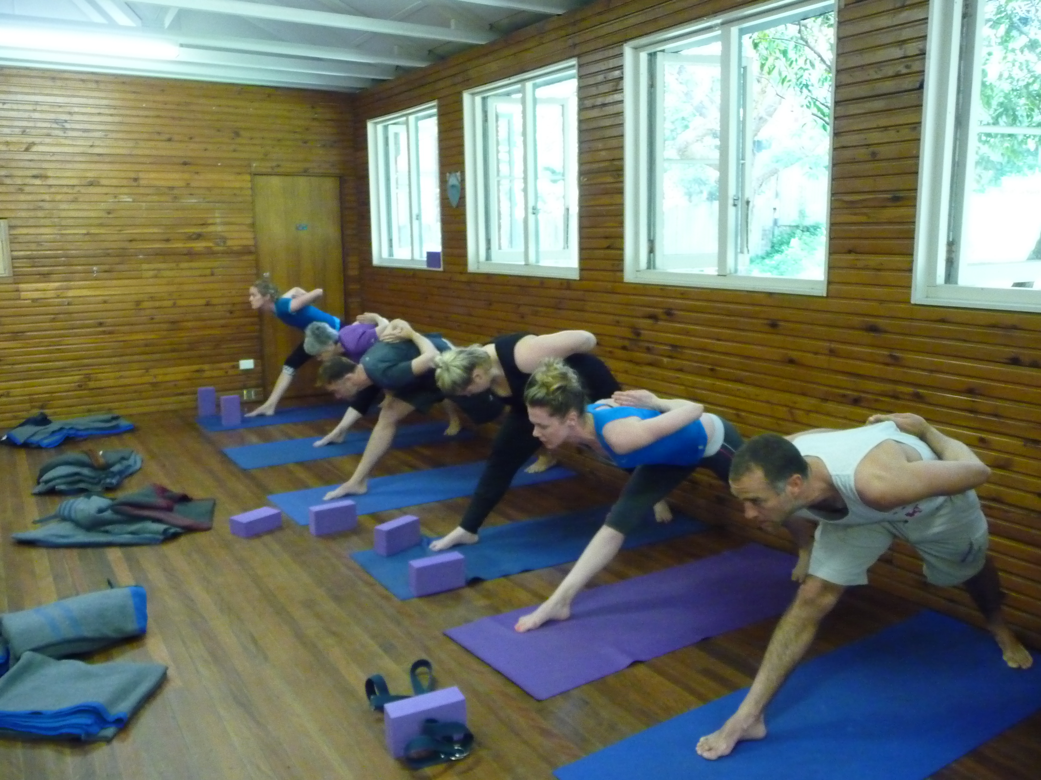 Group class practising extended side angle pose